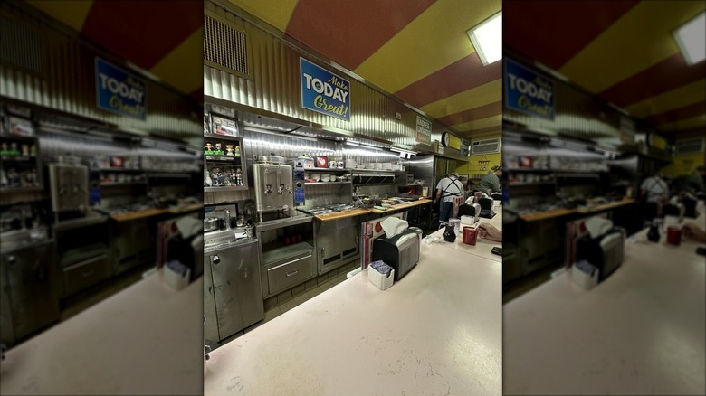 Open kitchen grill and counter seating at Ideal Diner