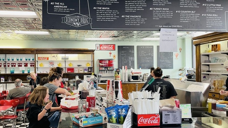 Interior with counter seating at Economy Drug & Old Fashioned Soda Fountain
