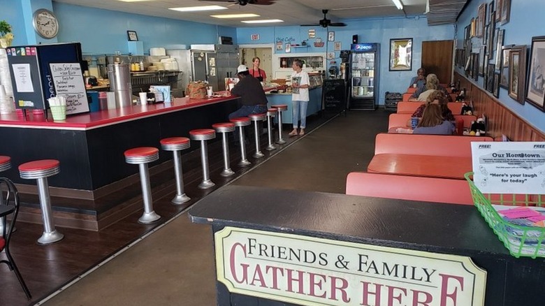 Interior dining area with booth and counter seating at Franklinville Diner