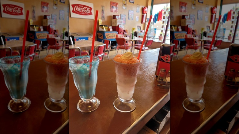 Two old fashioned milkshakes with retro interior dining area in background at Rockin Relics