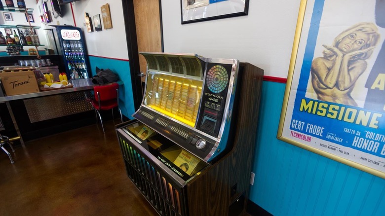 Interior dining area with authentic jukebox at 60's Cafe & Diner