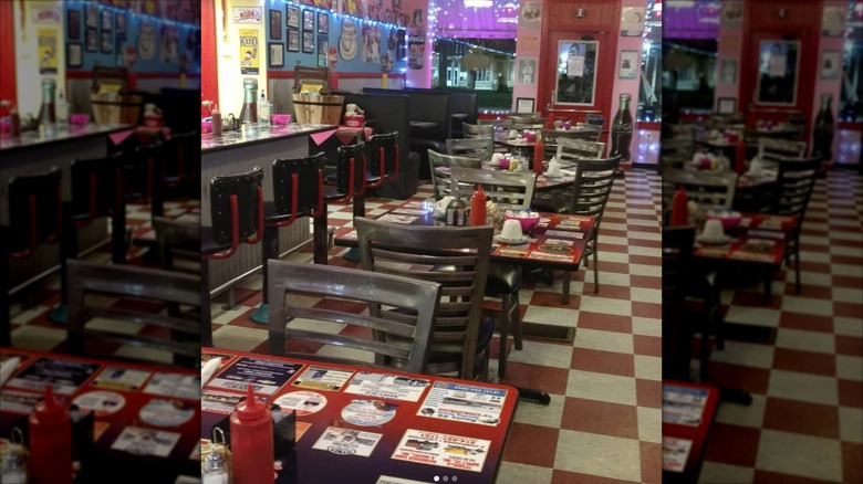 Interior dining area with red and white checkerboard flooring at Missy's Arcade Restaurant