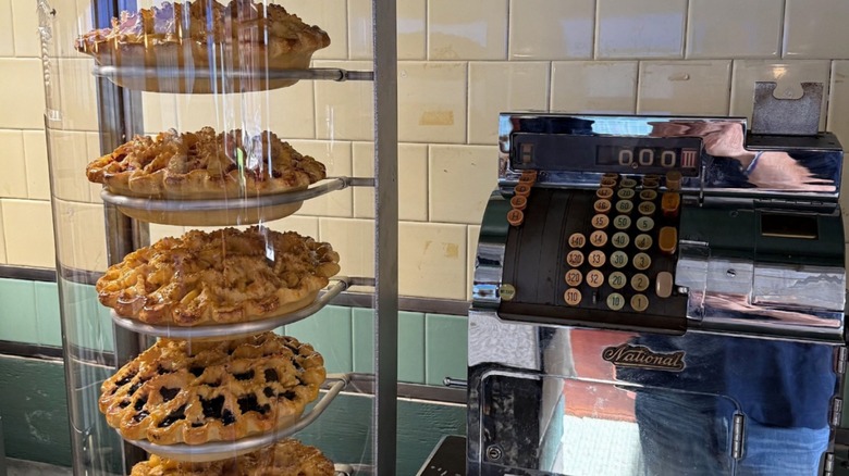 Fresh homemade pies in a glass display and old time vintage cash register at Jigger's Diner 