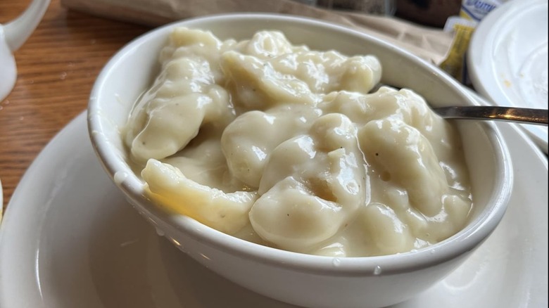 Chicken N' Dumplins in a white bowl on a white plate at Cracker Barrel