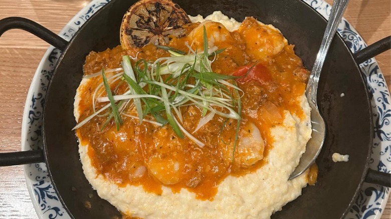 Shrimp and Grits in a skillet at Tupelo Honey Southern Kitchen