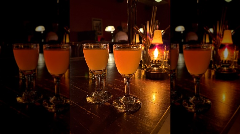 Two drinks sitting on a lowly lit bar at Williams & Graham