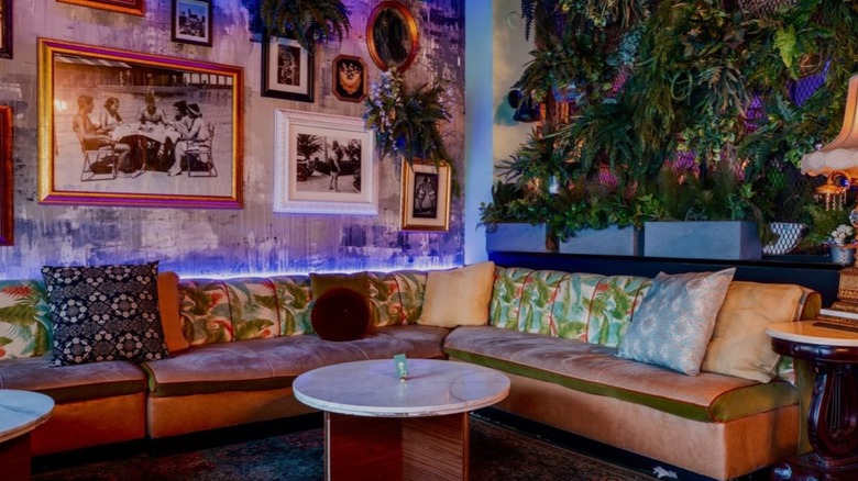 '90s-inspired dining lounge area with couch at The Sylvester