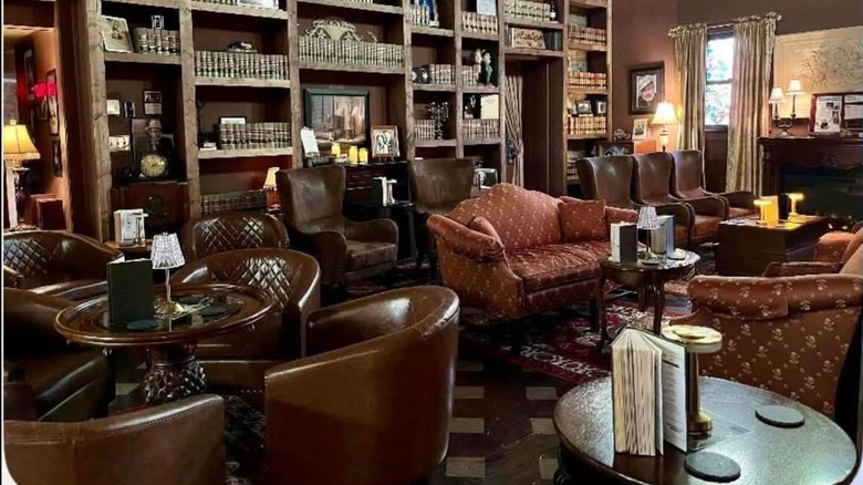 Interior of The Study with vintage decor and shelves of books lining the walls