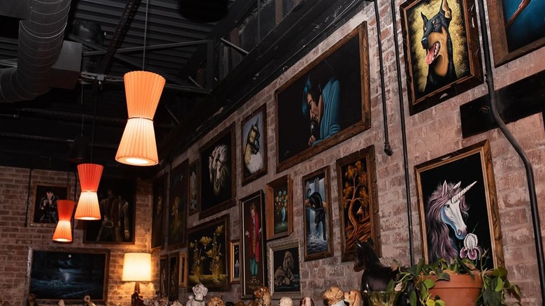 Cool retro interior with walls lined with old school art at Fly by Night