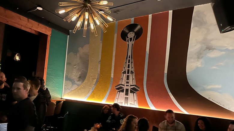 Colorful vintage interior aesthetic with chandelier at Revelry Room