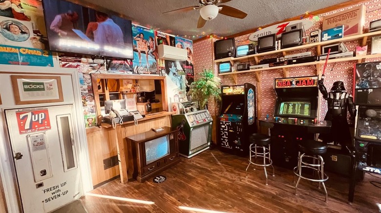 Retro entrance featuring arcade machines and old fashioned soda machine at Don's TV & Repair Speakeasy