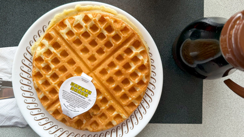 A Waffle House sweet cream waffle is served with butter