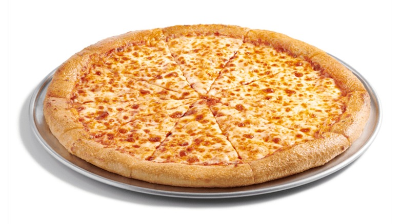 Cici's large cheese pizza sitting on a pizza tray on a white background.