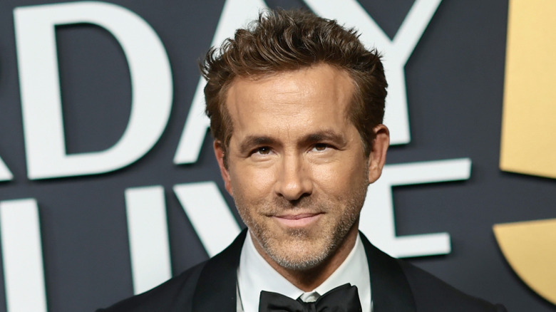 Ryan Reynolds smiling at an event