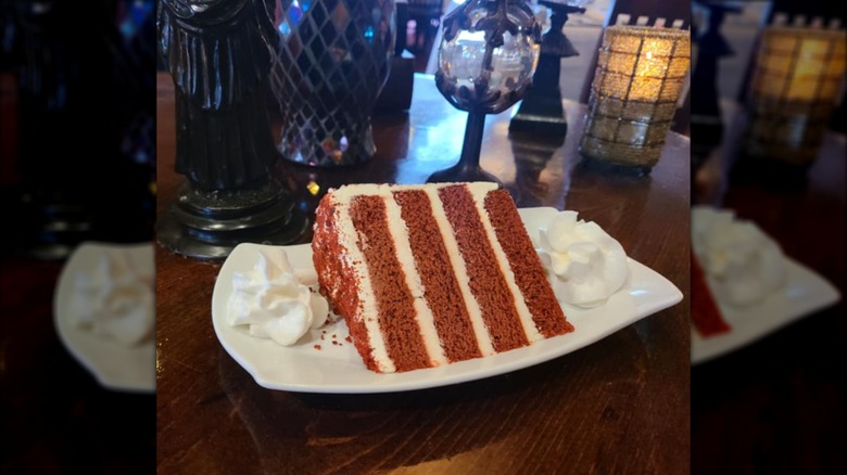 A slice of red velvet cake served on a plate.