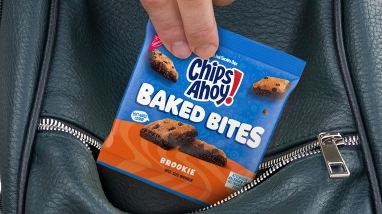 Person pulling package of Chip Ahoy Baked Bites Brookie out of backpack