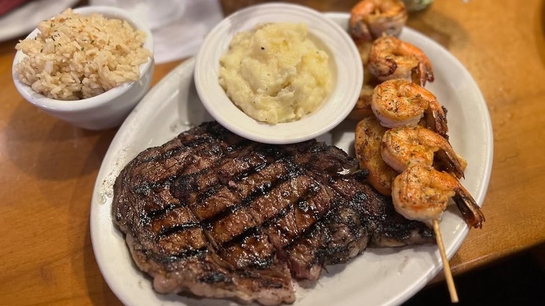 Steak, shrimp skewers, mashed potatoes, and rice from Texas Roadhouse