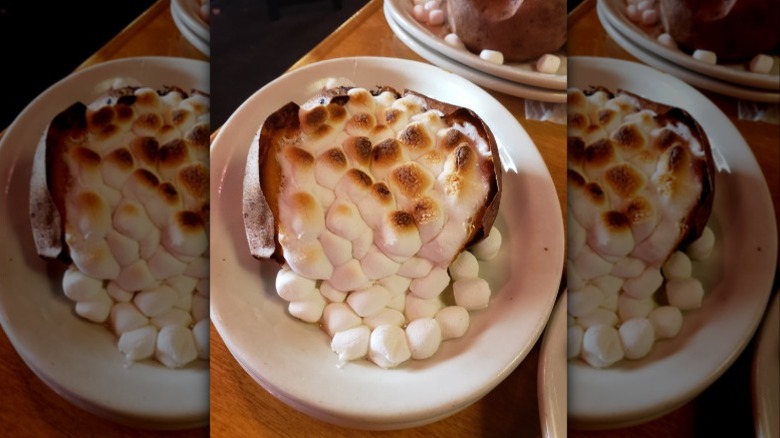 The marshmallow-loaded baked sweet potato served at Texas Roadhouse