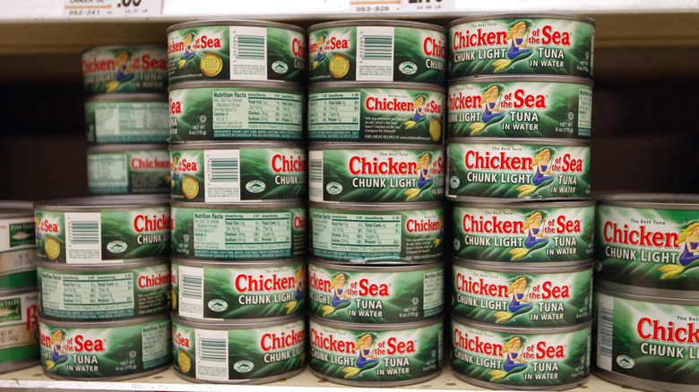 Stack of Chicken of the Sea cans of tuna