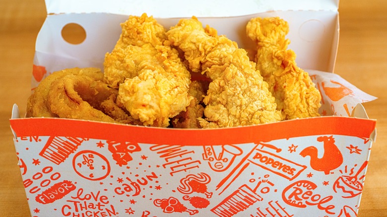 A box of chicken strips from Popeyes