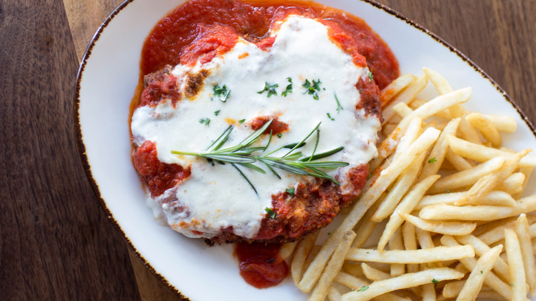 Burrata on chicken parmesan with French fries