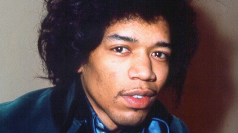 Jimi Hendrix wearing a blue suit