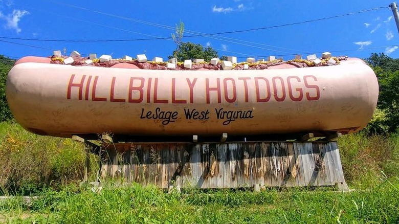An oversized hot dog sculpture advertising Hillbilly Hotdogs restaurant in West Virginia
