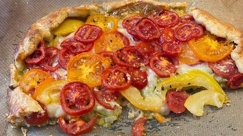 Stanley Tucci's Instagram post depicting the tomato and cheese crostata he made using Ina Garten's recipe.