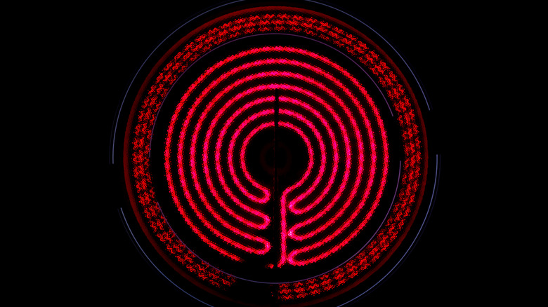 A glowing red coil warms an induction stovetop