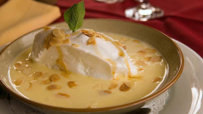 A floating island dessert in creme anglaise sauce
