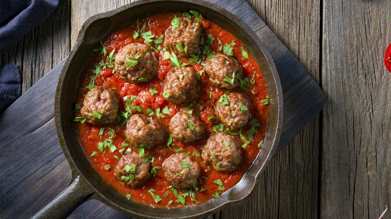 Meatballs and sauce in pan