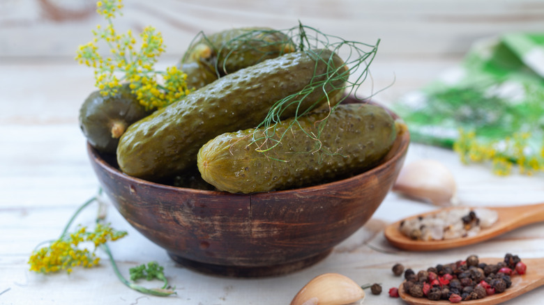 A bowl of whole pickles