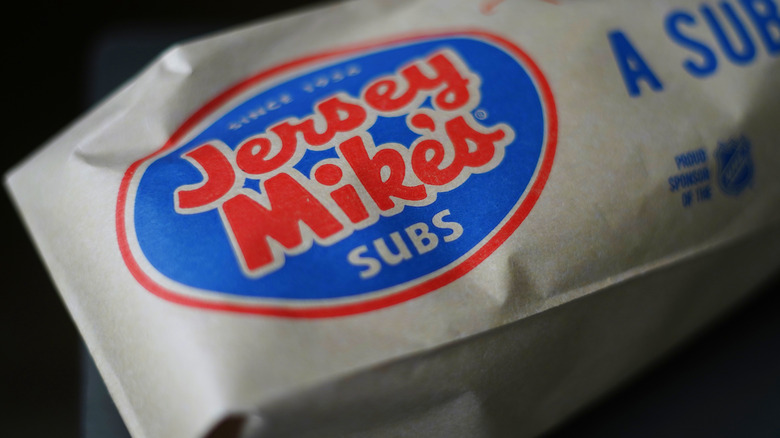 Close-up of brown Jersey Mike's Subs bag with a sandwich inside of it