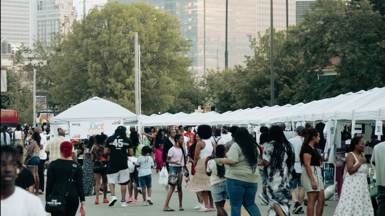 Tulsa Juneteenth festival with a crowd of people and tents