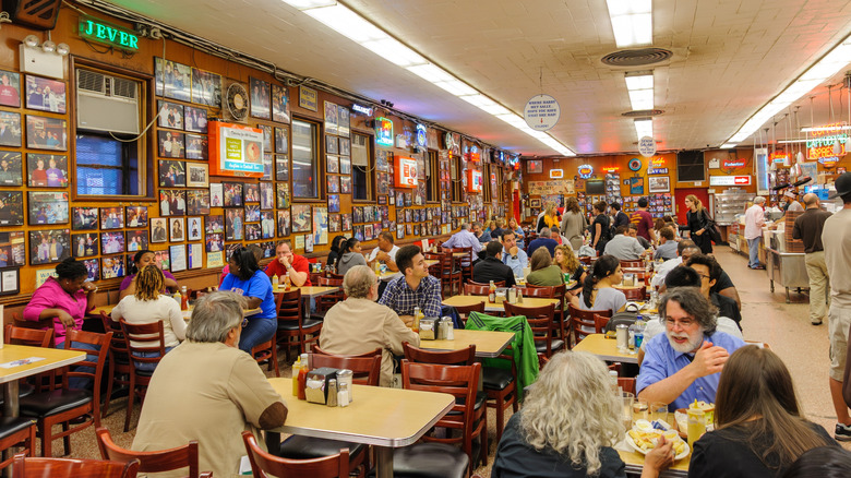 The interior of Katz's Delicatessen with several customers in it in Manhattan, New York