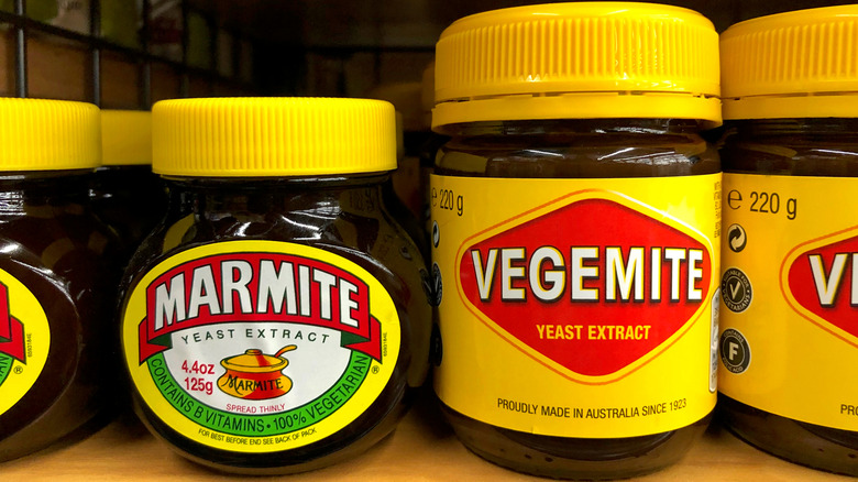 Jars of Marmite and Vegemite next to each other on a shelf