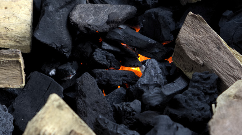 charcoal and wood chips in a grill
