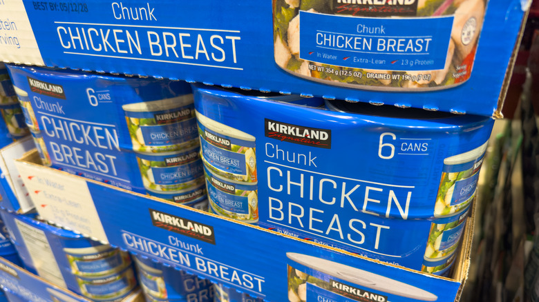 Stacks of canned chicken at a grocery store