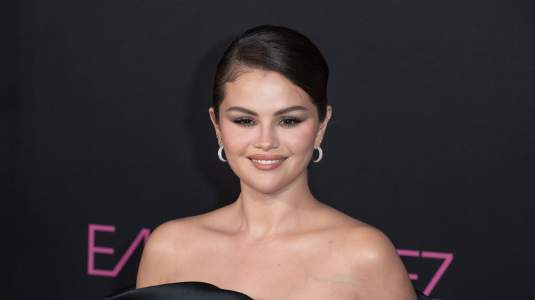 selena gomez against black background