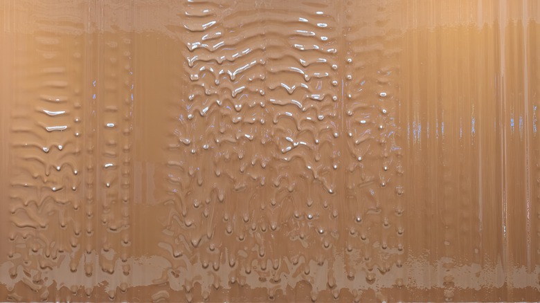 A wall of melting, dripping milk chocolate