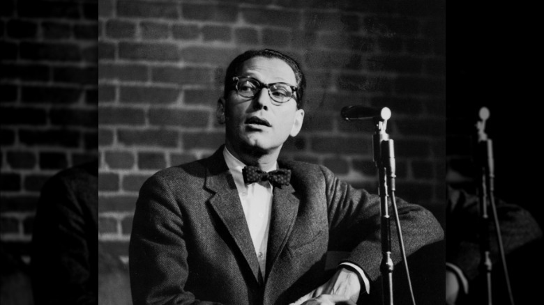 Tom Lehrer at a microphone
