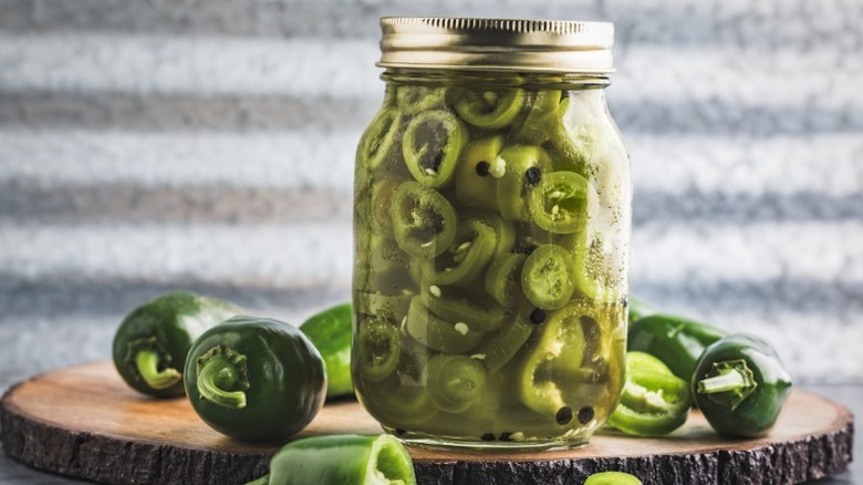 A jar of pickled jalapeño peppers.