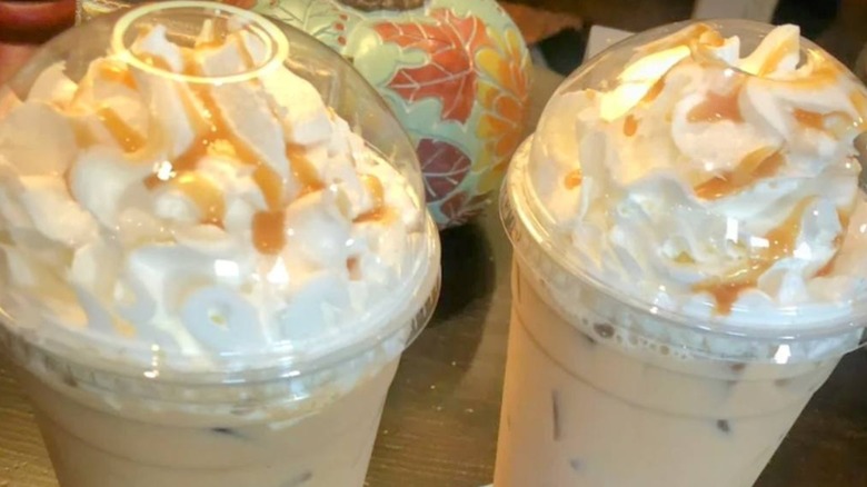 two coffee drinks with whipped cream and caramel drizzle from Nichols Nook Coffee House