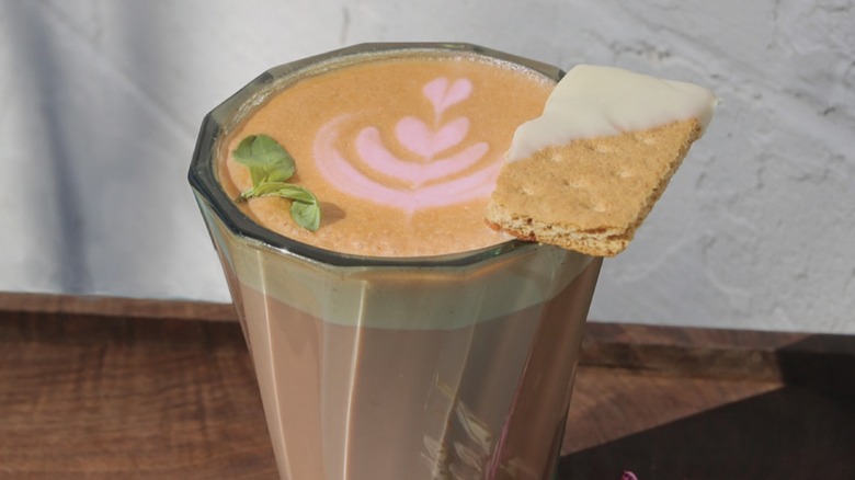 House Finch coffee drink, with Rhubarb, Strawberry, Graham Cracker with White Chocolate, Sprig of Basil, Espresso, and Milk from Word Coffee