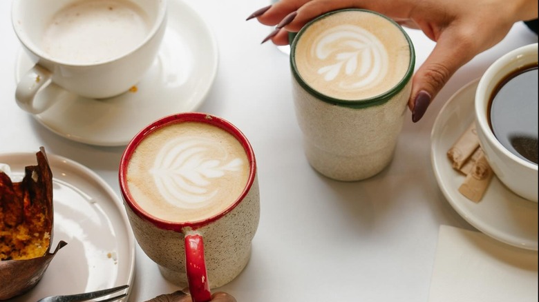 two lattes beside two other coffee drinks from Valor Coffee