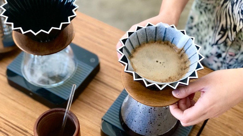 Barista working a pour over coffee setup at Oddly Correct