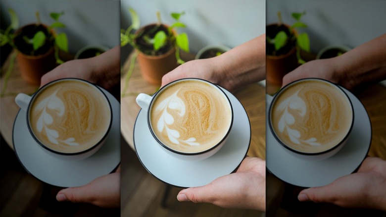 Latte with latte art from Deeper Roots Coffee