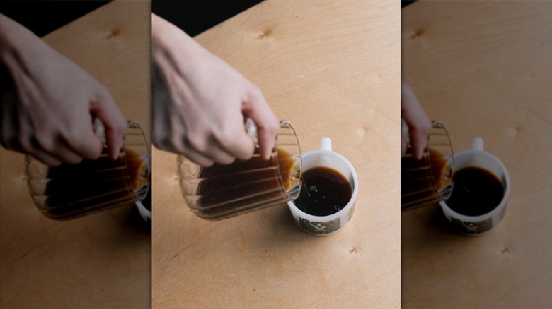 Barista pouring a cup of coffee at Push x Pull