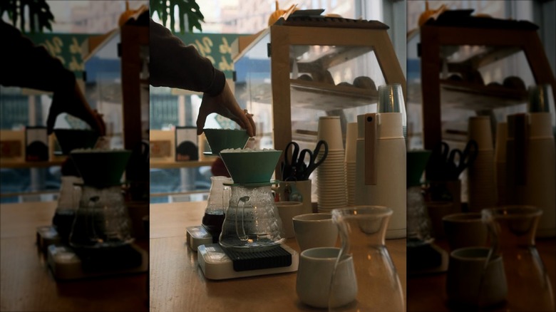 Barista making a pour over at Thank You Thank You