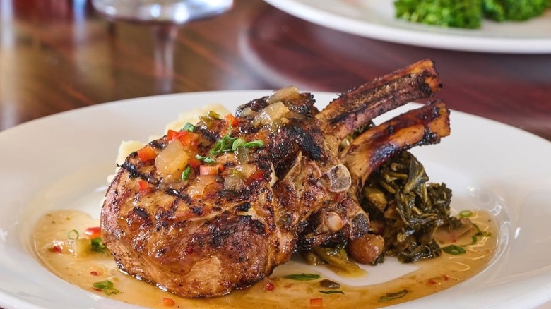 A plate of pork chops served at Muriel's Jackson Square.